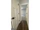 Hallway with hardwood flooring leading to a carpeted bedroom at 149 Silvercrest Dr # 58, Acworth, GA 30101