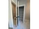 Hallway with a toilet room, and a closet with wire shelving at 149 Silvercrest Dr # 58, Acworth, GA 30101