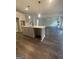 Kitchen island and open concept to living area at 149 Silvercrest Dr # 58, Acworth, GA 30101