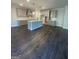 Modern kitchen featuring an island, grey cabinets, stainless steel appliances, and hardwood floors at 149 Silvercrest Dr # 58, Acworth, GA 30101