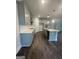 Kitchen featuring stainless steel appliances, gray cabinets, white countertops, and hardwood floors at 149 Silvercrest Dr # 58, Acworth, GA 30101
