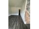 Modern living room featuring hardwood floors, natural light, staircase, and an entry doorway at 149 Silvercrest Dr # 58, Acworth, GA 30101