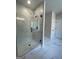 Bathroom featuring a large glass shower with a window and marble tiling at 149 Silvercrest Dr # 58, Acworth, GA 30101