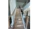 A staircase featuring wood steps and black iron spindles at 149 Silvercrest Dr # 58, Acworth, GA 30101
