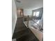 Hallway staircase with hardwood floors and black metal railings at 149 Silvercrest Dr # 58, Acworth, GA 30101