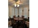 Charming dining area with hardwood floors, lots of natural light, and seating for four at 1129 River Green Ct, Mcdonough, GA 30252