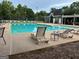 Exterior pool area featuring lounge chairs, and umbrellas at 1129 River Green Ct, Mcdonough, GA 30252