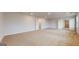 Large primary bedroom with neutral carpet, walk-in closet, and natural light at 95 Jacoby Dr # 103, Fairburn, GA 30213