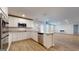 Bright, open-concept kitchen features granite countertops, stainless steel appliances, and island at 95 Jacoby Dr # 103, Fairburn, GA 30213