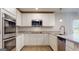 Modern kitchen with stainless appliances, granite counters, and white cabinetry at 95 Jacoby Dr # 103, Fairburn, GA 30213