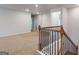 Open loft area with carpet and natural light at 95 Jacoby Dr # 103, Fairburn, GA 30213