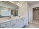 Bathroom featuring a large double sink vanity, glass enclosed shower, and soaking tub at 112 Felicity Pike, Locust Grove, GA 30248