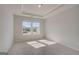 Cozy bedroom with carpet floors and plenty of natural light from the windows at 112 Felicity Pike, Locust Grove, GA 30248