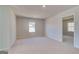 Neutral bedroom with carpet flooring, ample natural light, and ensuite access at 112 Felicity Pike, Locust Grove, GA 30248
