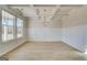 Elegant dining room featuring a coffered ceiling, wainscoting, and ample natural light at 112 Felicity Pike, Locust Grove, GA 30248