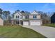 Charming two-story brick home with a well-kept lawn and an attached two-car garage at 112 Felicity Pike, Locust Grove, GA 30248