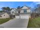 Beautiful two-story house boasting a spacious three-car garage and a lush green lawn at 112 Felicity Pike, Locust Grove, GA 30248