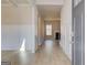 Inviting foyer with light wood floors and elegant white wainscoting at 112 Felicity Pike, Locust Grove, GA 30248