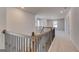 Hallway upstairs with wooden banister at 112 Felicity Pike, Locust Grove, GA 30248