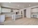 Modern kitchen features white cabinets, an island, and stainless steel appliances at 112 Felicity Pike, Locust Grove, GA 30248
