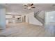 Spacious open-concept living area with hardwood floors and stairs to upper level at 112 Felicity Pike, Locust Grove, GA 30248