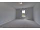 Neutral bedroom with carpet, one window, and recessed lighting that provides calm ambiance at 120 Felicity Pike, Locust Grove, GA 30248