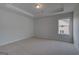 Well lit bedroom featuring neutral carpet and a bright window at 120 Felicity Pike, Locust Grove, GA 30248