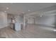 Open-concept floor plan featuring a spacious kitchen area open to the living room and stairs to another floor at 120 Felicity Pike, Locust Grove, GA 30248