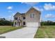 Attractive two-story brick home with a two-car garage, set on a green lot with a concrete driveway at 120 Felicity Pike, Locust Grove, GA 30248
