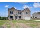 Charming two-story brick home with an attached two-car garage and a well-maintained front yard at 120 Felicity Pike, Locust Grove, GA 30248