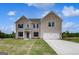Beautiful two-story brick home featuring a two-car garage, well-kept lawn, and dark blue shutters at 120 Felicity Pike, Locust Grove, GA 30248