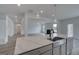View from the kitchen island into an open plan living space with a fireplace at 120 Felicity Pike, Locust Grove, GA 30248