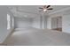 This spacious main bedroom offers plush carpeting and a tray ceiling with recessed lighting at 120 Felicity Pike, Locust Grove, GA 30248