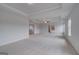 Spacious main bedroom boasts plush carpet, tray ceiling, and ensuite access for modern comfort at 120 Felicity Pike, Locust Grove, GA 30248