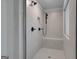 Modern tiled shower equipped with rain shower head, bench seat, and sleek matte fixtures at 120 Felicity Pike, Locust Grove, GA 30248
