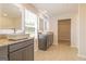 Modern bathroom featuring double sinks, granite countertops and tile flooring at 220 Fern Dale Dr # 71, Fairburn, GA 30213