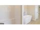 Elegant bathroom with a modern soaking tub, subway tile and a separate shower area at 220 Fern Dale Dr # 71, Fairburn, GA 30213