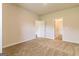 Spacious bedroom featuring plush carpeting, neutral walls, and multiple doorways at 220 Fern Dale Dr # 71, Fairburn, GA 30213