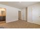 A modern bedroom with neutral walls, carpet, and ensuite bathroom at 220 Fern Dale Dr # 71, Fairburn, GA 30213