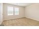 Bright bedroom featuring neutral walls, carpet, and window views at 220 Fern Dale Dr # 71, Fairburn, GA 30213