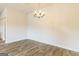 Bright dining area with wood floors and a modern chandelier, perfect for entertaining at 220 Fern Dale Dr # 71, Fairburn, GA 30213