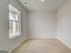Sun-drenched bedroom featuring large window, neutral paint and hardwood floors at 221 Ruthe Cv, Locust Grove, GA 30248