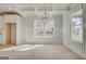 Bright dining room featuring decorative molding, hardwood floors and lots of windows at 221 Ruthe Cv, Locust Grove, GA 30248