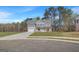 Charming two-story home boasts a landscaped yard, attached two-car garage, and traditional architectural details at 221 Ruthe Cv, Locust Grove, GA 30248