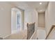 Hallway with carpeted floors, white trim, and doors leading to various rooms at 221 Ruthe Cv, Locust Grove, GA 30248