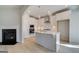 Modern kitchen with stainless steel appliances, sleek white cabinetry, and an eat-in island at 221 Ruthe Cv, Locust Grove, GA 30248