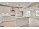 Modern kitchen boasts stainless appliances, white cabinets, and a center island perfect for entertaining at 221 Ruthe Cv, Locust Grove, GA 30248