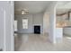 Bright and airy living room with modern fireplace, hardwood floors and contemporary ceiling fan at 221 Ruthe Cv, Locust Grove, GA 30248