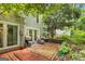 Relaxing brick patio with garden space and mature trees at 2694 Greentree Se Dr, Marietta, GA 30067