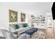 Inviting living room with built-in bookshelves, a cozy sofa, stylish decor, and ample space for relaxation and entertainment at 2694 Greentree Se Dr, Marietta, GA 30067